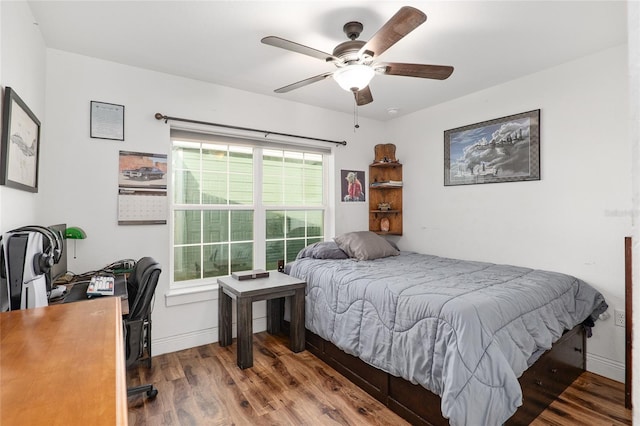 bedroom with hardwood / wood-style flooring and ceiling fan