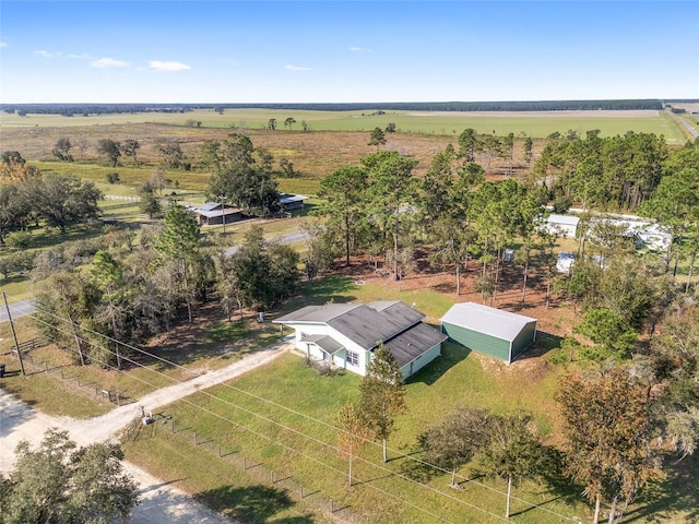 birds eye view of property featuring a rural view