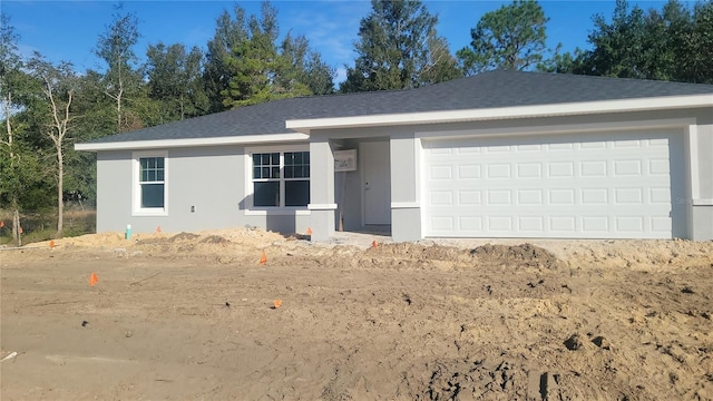 single story home with a garage