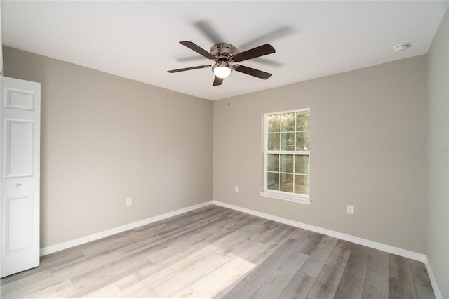 empty room featuring ceiling fan and light hardwood / wood-style flooring