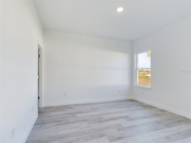 spare room with light hardwood / wood-style floors