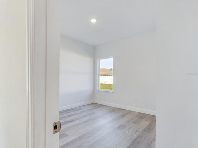 spare room featuring light hardwood / wood-style floors