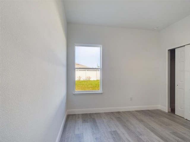 spare room featuring light hardwood / wood-style floors