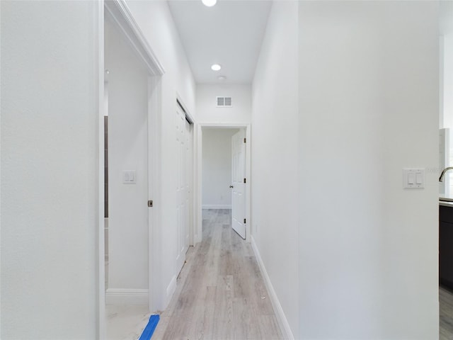 corridor featuring light wood-type flooring