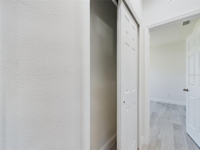 corridor featuring light wood-type flooring