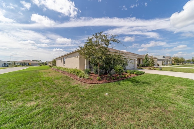 view of property exterior with a garage and a lawn