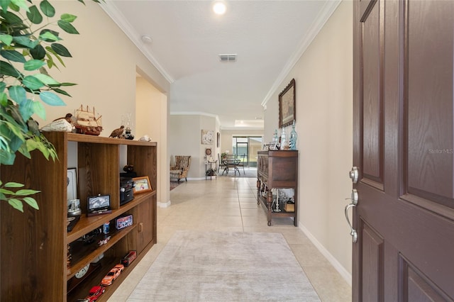 tiled entrance foyer with ornamental molding