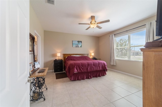 bedroom featuring light tile patterned floors and ceiling fan