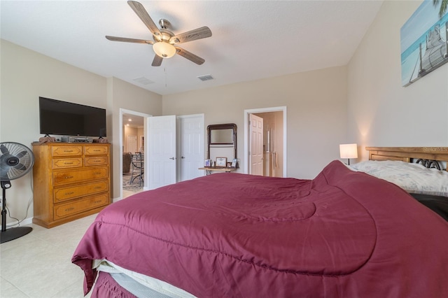 bedroom with ensuite bath and ceiling fan