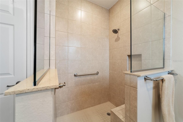 bathroom featuring tiled shower