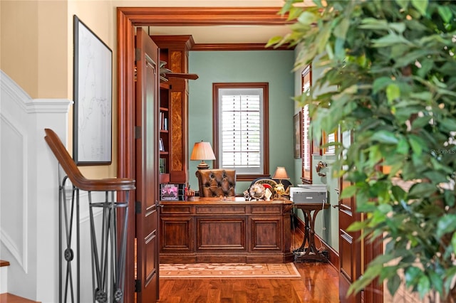 interior space featuring wood-type flooring and ornamental molding