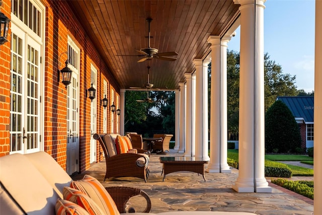 view of patio featuring ceiling fan, french doors, and covered porch