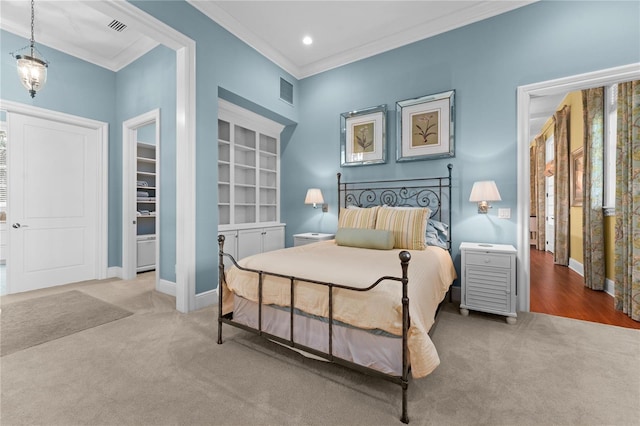 carpeted bedroom featuring ornamental molding