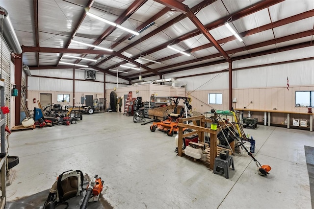 garage featuring a workshop area and metal wall