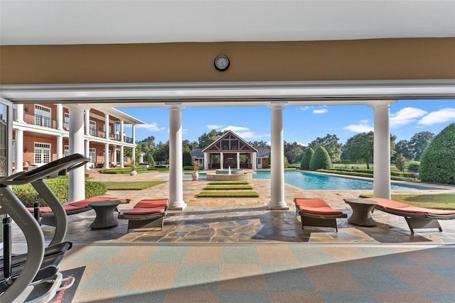 view of patio / terrace featuring an outdoor pool and a gazebo