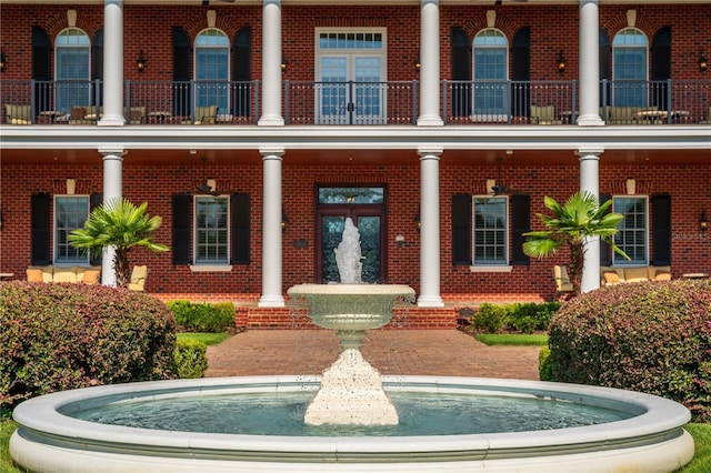 property entrance featuring brick siding