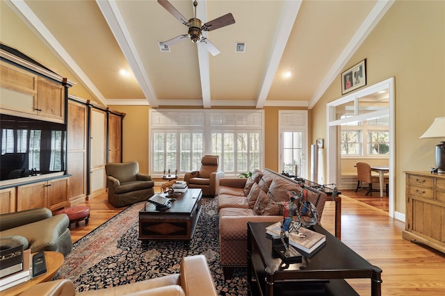 living room featuring a barn door, lofted ceiling with beams, ceiling fan, ornamental molding, and light hardwood / wood-style flooring