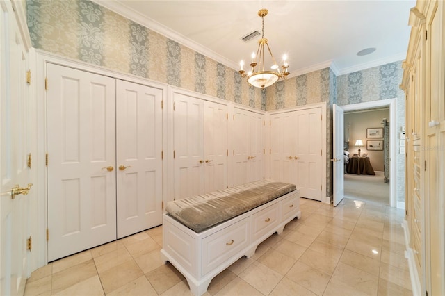 mudroom with ornamental molding, light tile patterned floors, and a chandelier