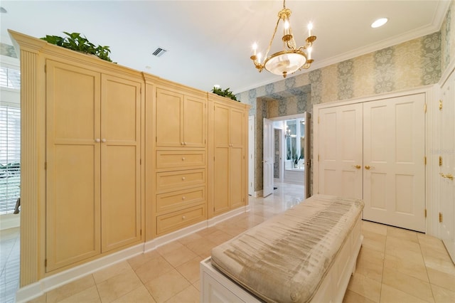 interior space with a notable chandelier, ornamental molding, and light tile patterned floors