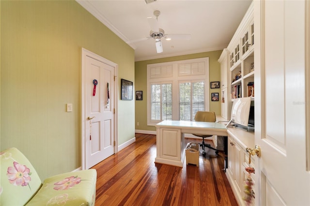 home office with crown molding, dark wood-type flooring, and ceiling fan