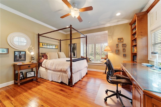 bedroom with light hardwood / wood-style floors, ornamental molding, multiple windows, and ceiling fan