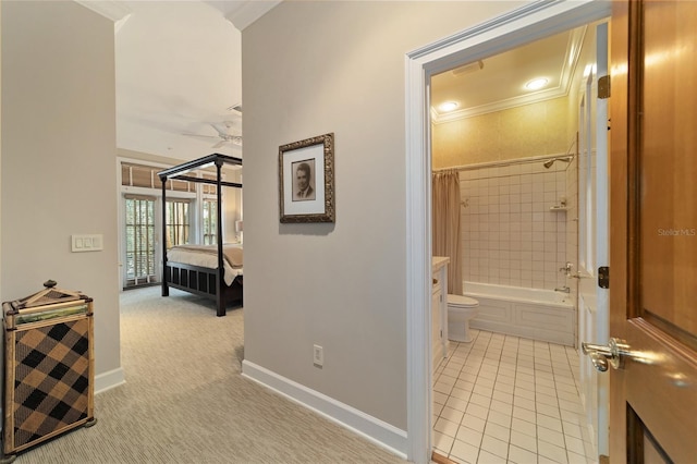 hall featuring crown molding and light carpet