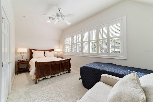 carpeted bedroom with vaulted ceiling, multiple windows, and ceiling fan