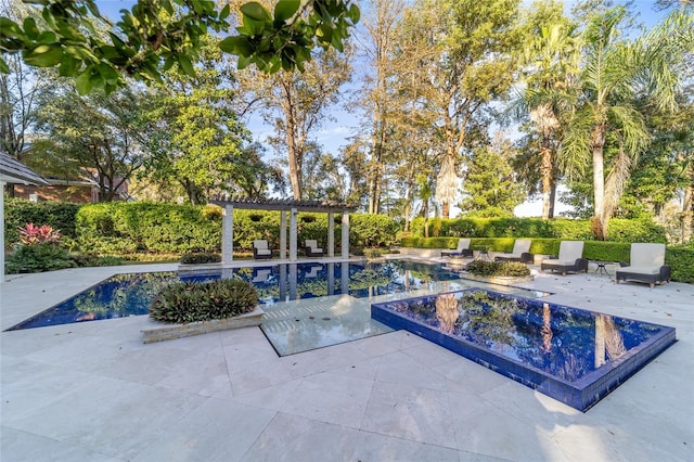 view of swimming pool featuring a patio area