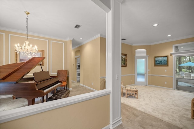 corridor featuring visible vents, ornamental molding, carpet flooring, arched walkways, and a notable chandelier