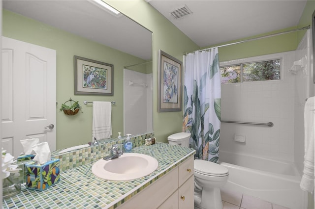 bathroom featuring tile patterned flooring, visible vents, toilet, shower / tub combo with curtain, and vanity