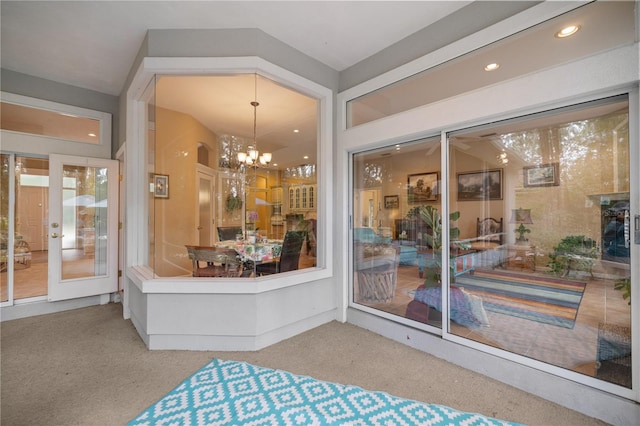 interior space with recessed lighting, french doors, and a chandelier