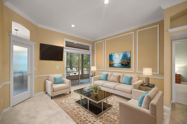 carpeted living area featuring crown molding, baseboards, and recessed lighting