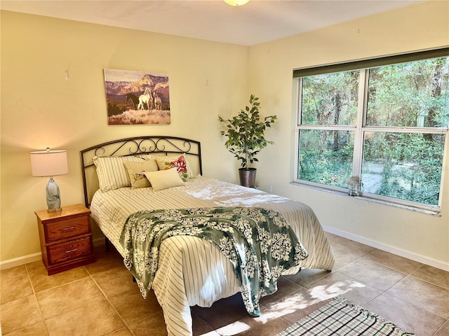 tiled bedroom with baseboards