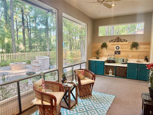 sunroom / solarium featuring a sink