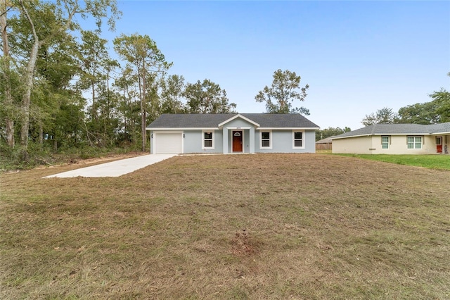 ranch-style home with a front yard and a garage