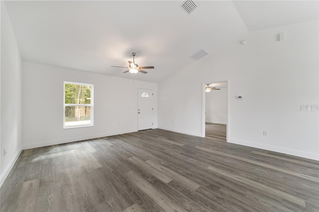 unfurnished living room featuring ceiling fan, vaulted ceiling, and dark hardwood / wood-style flooring