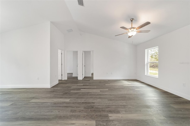 spare room with ceiling fan, vaulted ceiling, and dark hardwood / wood-style flooring