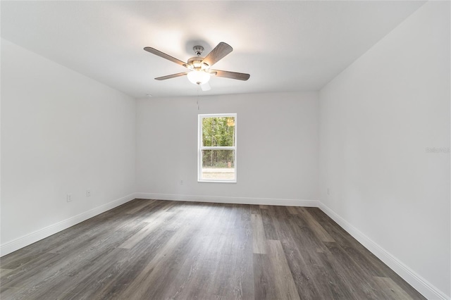 spare room featuring ceiling fan and dark hardwood / wood-style floors