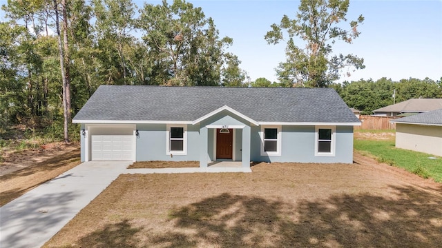 single story home featuring a garage