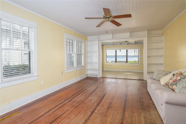 unfurnished living room with crown molding, wood-type flooring, wooden ceiling, and ceiling fan