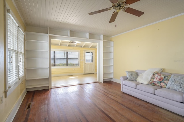 unfurnished living room with ornamental molding, ceiling fan, wood-type flooring, and wooden ceiling