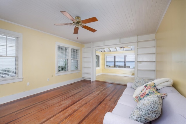 living room featuring ornamental molding, hardwood / wood-style floors, wood ceiling, and ceiling fan