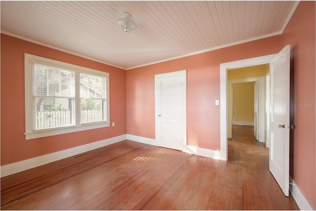 13414 SE 124th Pl, Ocklawaha, FL 32179 - spare room featuring wood ceiling, hardwood / wood-style flooring, baseboards, visible vents, and crown molding