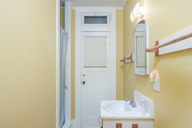 bathroom with vanity and curtained shower