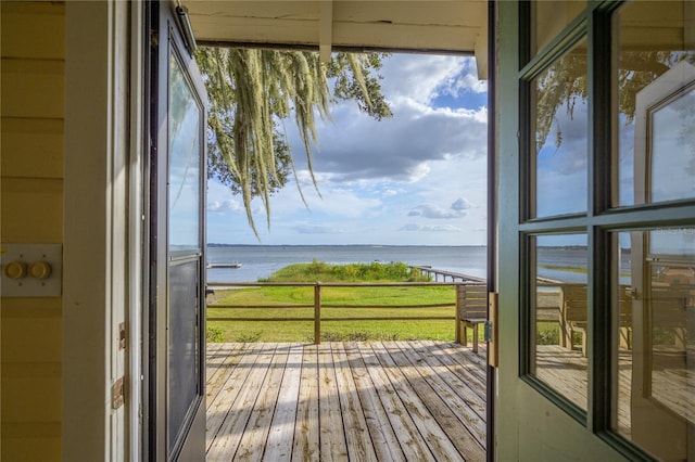 interior space with a yard and a water view