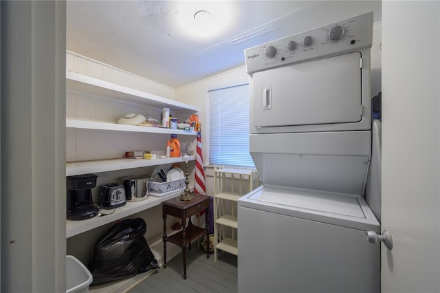 laundry room featuring stacked washer and dryer