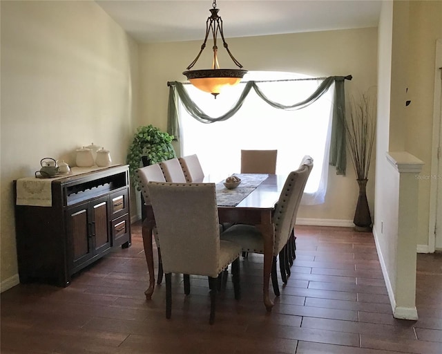 dining area with dark wood-type flooring