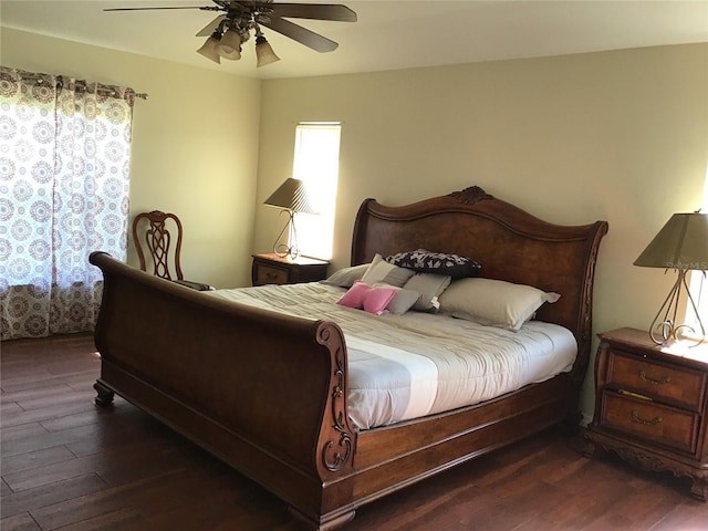 bedroom featuring dark wood-type flooring and ceiling fan