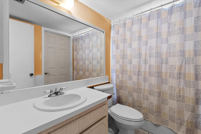 bathroom with vanity, a shower with curtain, and toilet