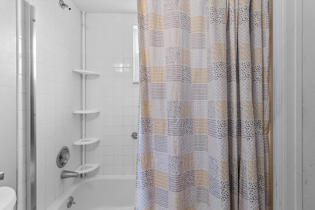 bathroom featuring shower / tub combo with curtain